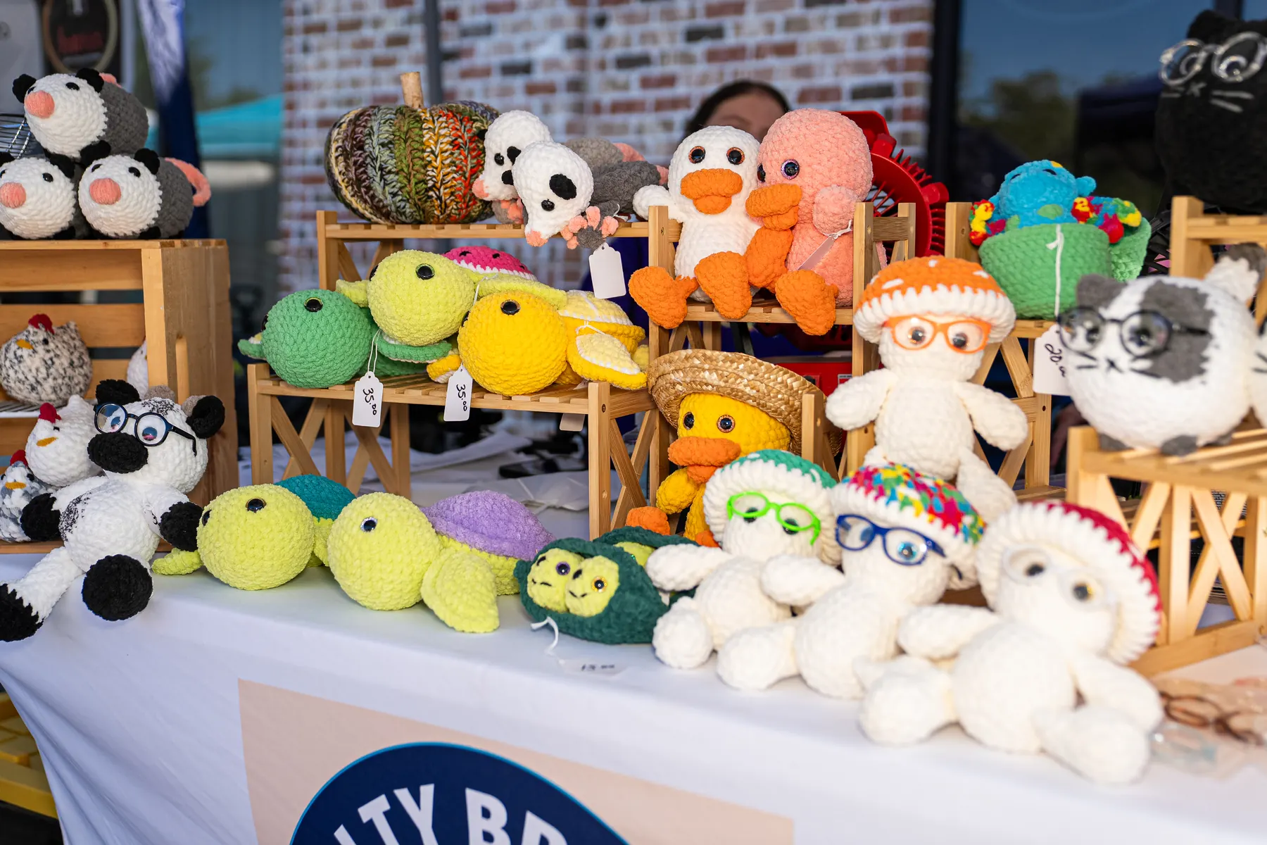 Handmade crochet creations at a Fall Market booth